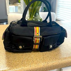Ladies black Franco Sarto purse with colored stripe down front.